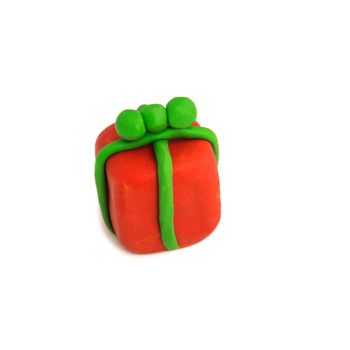 colorful christmas gift figure made of plasticine isolated on white background