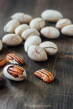 Organic Pecan nuts on brown wooden table