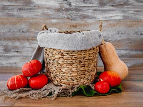 Stylized basket for newborn baby photoshoot with autumn veggies pampkin decor. Studio handmade scene for infant child halloween photos