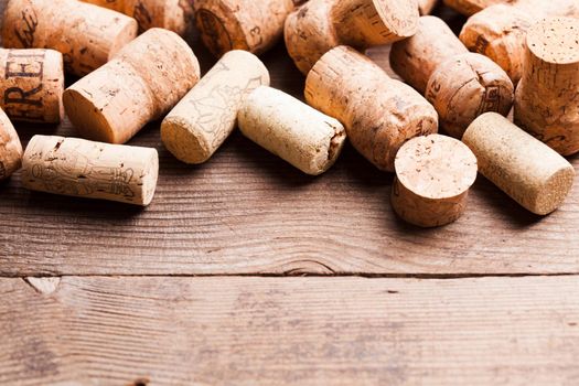 Corks on the wooden table. Wine and alcohol concept