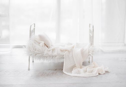 White composite for newborn photosession with bed, fur and pillow. Infant digital background for baby photography.