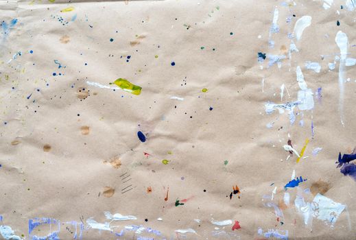 Abstract drawing of strokes and droplets at watercolor paper