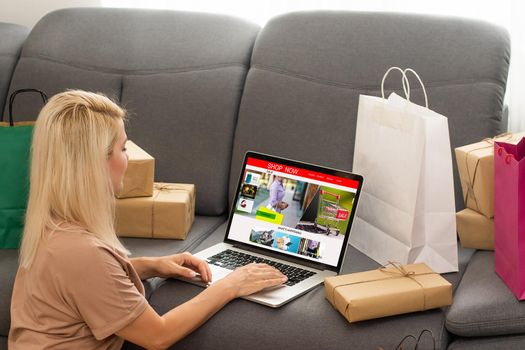 Pensive young woman looking for online sales.