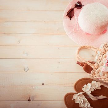 beach accessories on a white wooden background