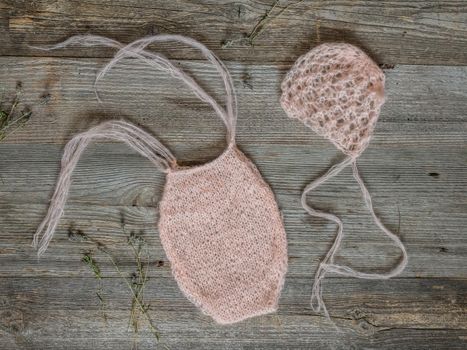 two little knitted pink woolen hats for newborn baby, top view