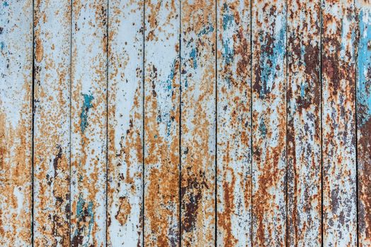 old planked wooden background with scratched paint on its surface