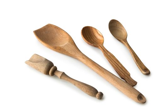 set of wooden kitchen spoons and other items on white background with textspace
