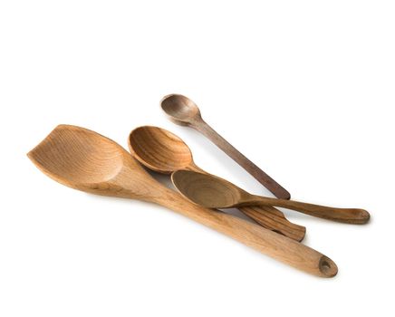 set of wooden kitchen spoons and other items on white background with textspace