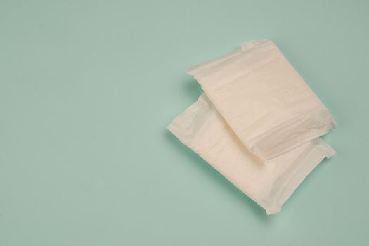 feminine pads underwear hygiene protection medicine blue background. High quality photo