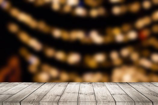 empty wooden floor or wooden terrace with abstract night light bokeh of night festival, blurred background, copy space for display of product or object presentation, vintage color tone.