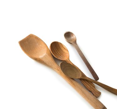 set of wooden kitchen spoons and other items on white background with textspace