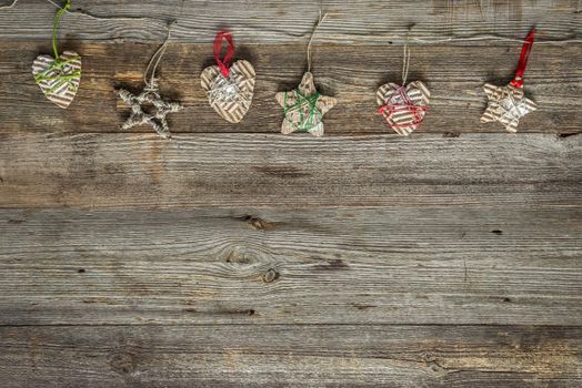 christmas handmade decorations on old wooden background with text space