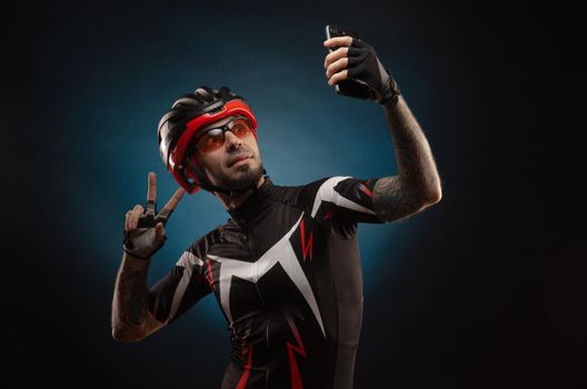 guy is a cyclist in a Bicycle helmet takes a selfie