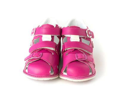 bright pink sandals for kids isolated on white background