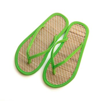 Pair of bamboo flip flops isolated on white