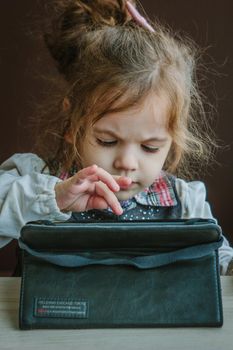 Girl with tablet pc in a restaurant or cafe.