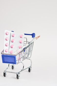 drug trolleys pharmacy shopping light background pharmacy. High quality photo