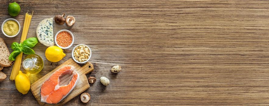 Healthy organic nutritious diet. Plenty of foods on the wooden table.