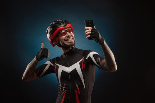 guy is a cyclist in a Bicycle helmet takes a selfie