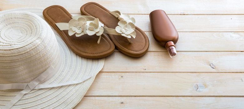 beach accessories on a white wooden background