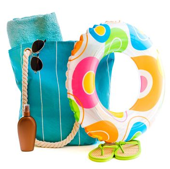 bag with beach accessories isolated on a white background