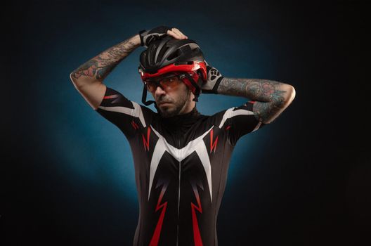 guy is a cyclist in a Bicycle helmet