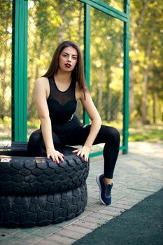 Girl training using sportground young adult woman workout posing Healthy lifestyle