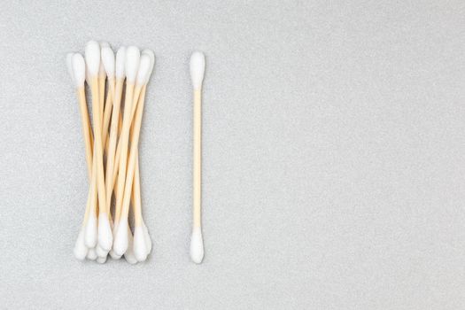 Wooden cotton swabs on grey background with copy space. Zero Waste, plastic free lifestyle concept