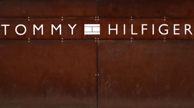 Germany, Dusseldorf - February 20, 2020. logo of the American brand Tommy Hilfiger. A sign at the entrance to the store on a wall of rusty metal. Copy space. Editorial photo