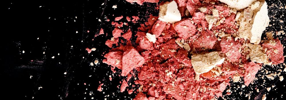 Crushed cosmetics, mineral organic eyeshadow, blush and cosmetic powder isolated on black background, makeup and beauty banner, flatlay design.