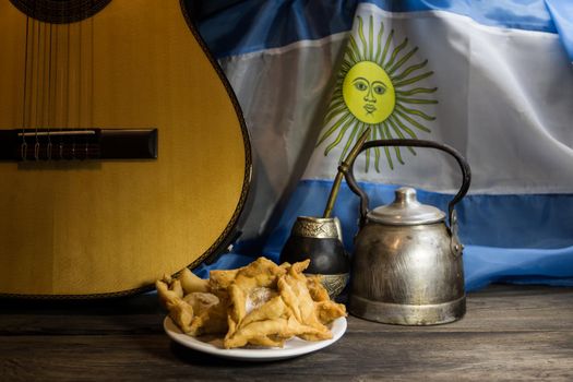 yerba mate, guitar and fried pastries, symbols of the Argentine tradition