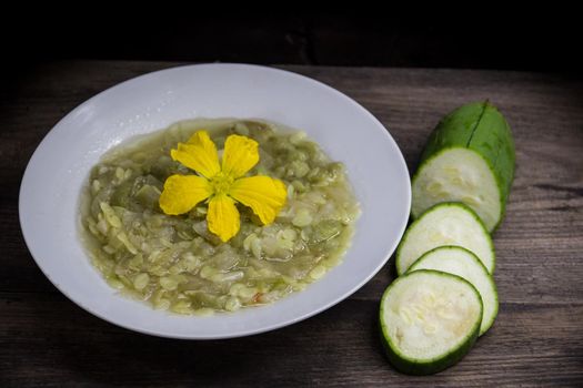 Dish of luffa or immature vegetable sponge fried with garlic and onion. Asian kitchen