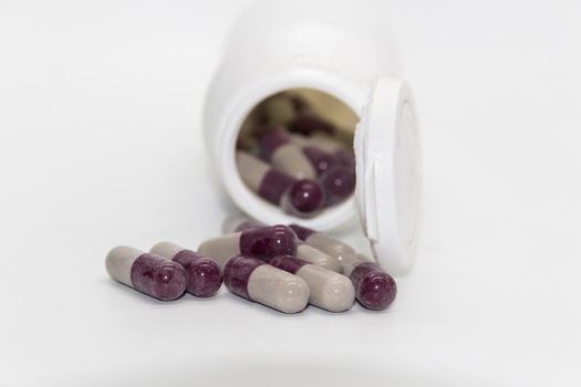 Detail of a bottle of capsules with medical drugs.Concept Medicine, health