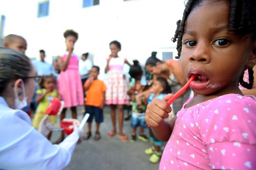 salvador, bahia, brazil - october 20, 2017:  dentita is tested in children's teething during social action in a daycare center in the city of Salvador.

