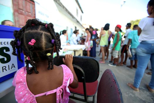 salvador, bahia, brazil - october 20, 2017:  dentita is tested in children's teething during social action in a daycare center in the city of Salvador.
