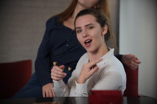 Portrait of young woman with funny face. Girl having fun. Close up