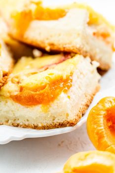 Slice of fresh baked apricot and cheese tart dessert