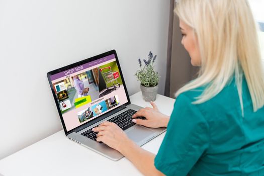 Young woman using laptop computer. Online shopping concept.