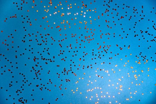 Abstract classic blue background with red little stars on it, for brochure, invitations. Holidays and new year, christmas conept.