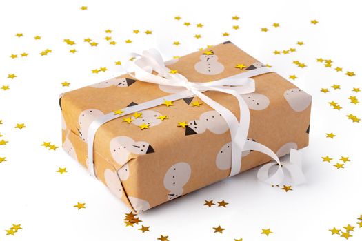 Christmas present gift box with confetti isolated on white background, close up