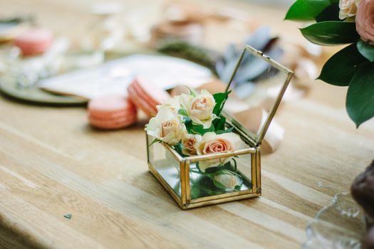 Wedding decoration - small rose flowers inside a glass casket