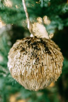 Vintage handmade Christmas tree toy hanging on a Christmas tree, close-up.