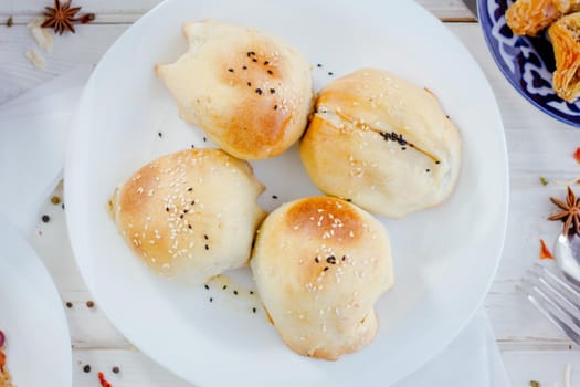 Top view of tandir samsa - popular asian pastries - on white plate, great image for your needs.