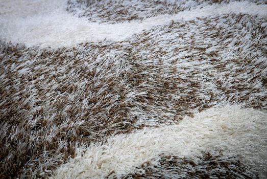 Close up view of carpet. Wall-to-wall carpeting background