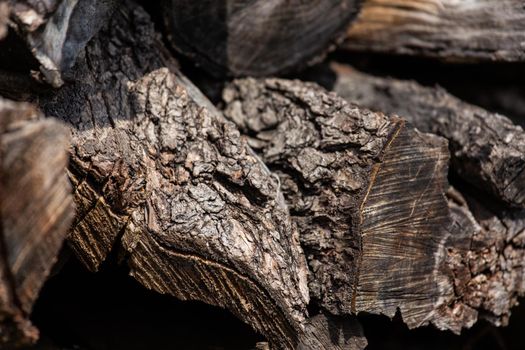 Background from stacked old brown stab wooden logs