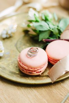 Wedding rings on a macaroon cakes as wedding decoration