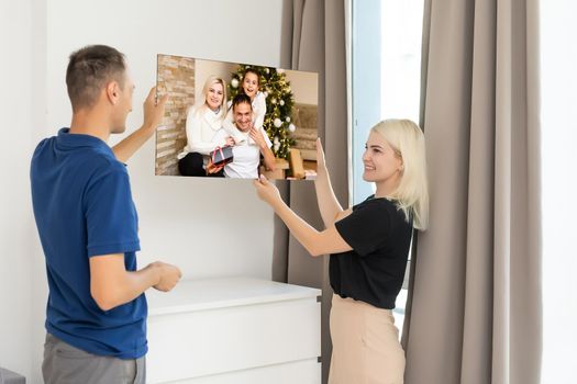 woman holding a photography with gallery stretch on a wooden frame. Printed photo on canvas.