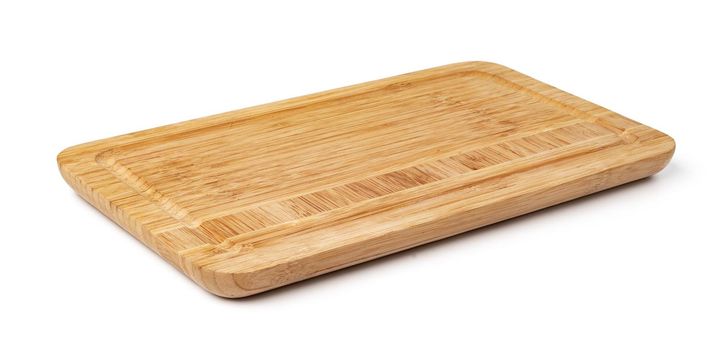 Wooden cutting board on a white background, close up