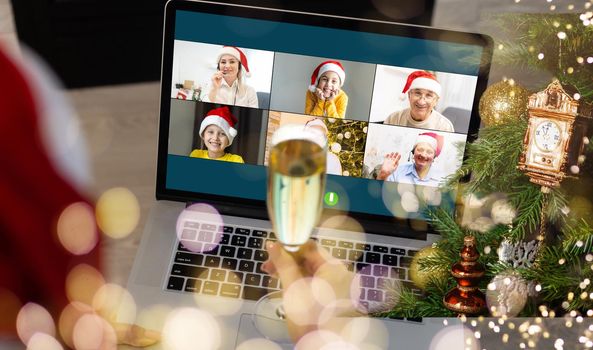 laptop with gift box and christmas lights background