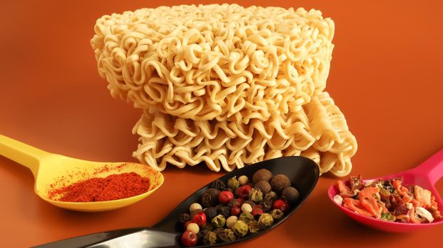 instant noodles with dry seasoning brown bowl, raw noodles. Vegetarian dish. Delicious Asian style dinner. pasta, for the preparation of which it is enough to pour boiling water and wait.